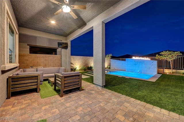 view of patio featuring ceiling fan, an outdoor living space, and a pool