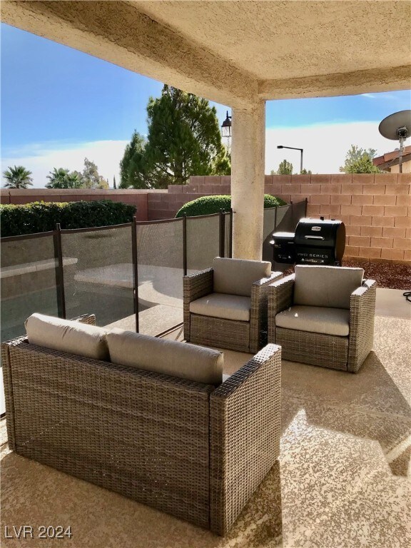 view of patio / terrace with outdoor lounge area and a grill