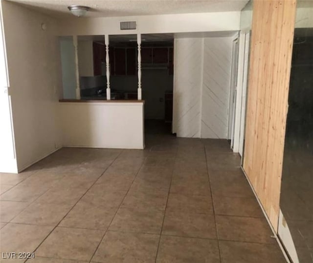 corridor featuring tile patterned flooring