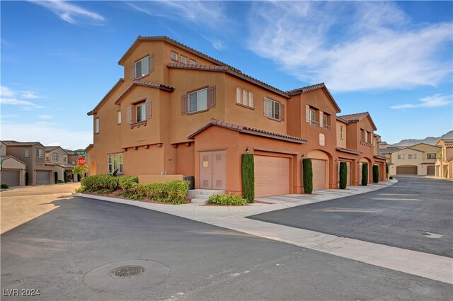 view of property featuring a garage