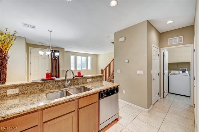 kitchen with sink, a chandelier, washer / clothes dryer, dishwasher, and light stone countertops