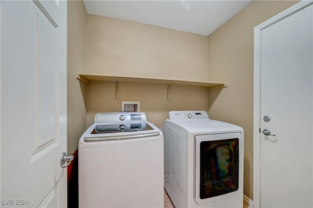 laundry room with washer and dryer