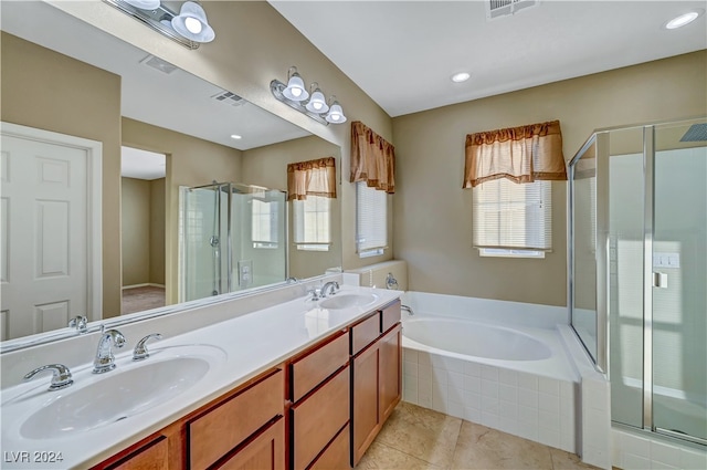 bathroom with tile patterned flooring, vanity, and independent shower and bath