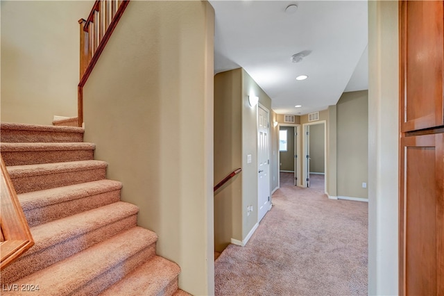 staircase with carpet