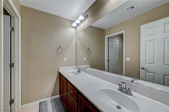 bathroom with vanity and tile patterned flooring