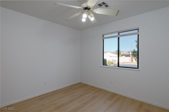 spare room with ceiling fan and light hardwood / wood-style floors