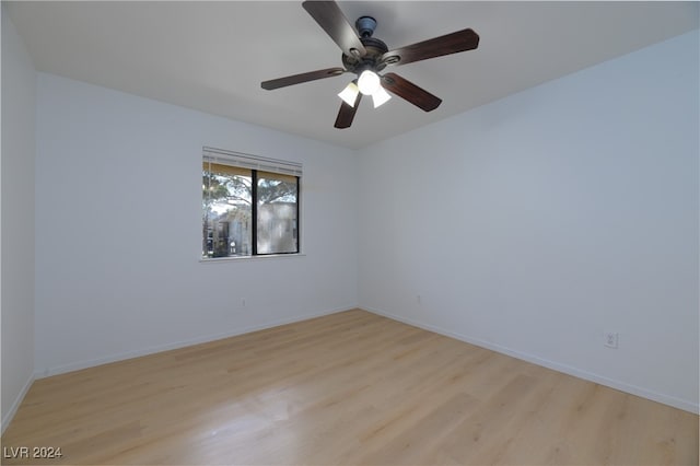 spare room with light hardwood / wood-style floors and ceiling fan