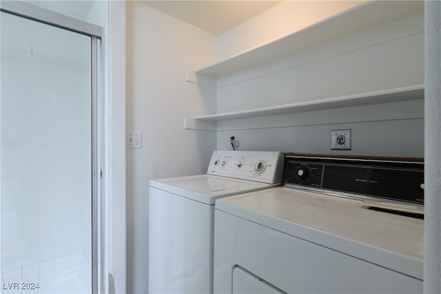 laundry area with washing machine and clothes dryer