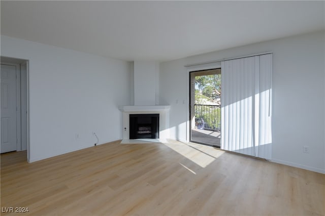 unfurnished living room with light hardwood / wood-style flooring