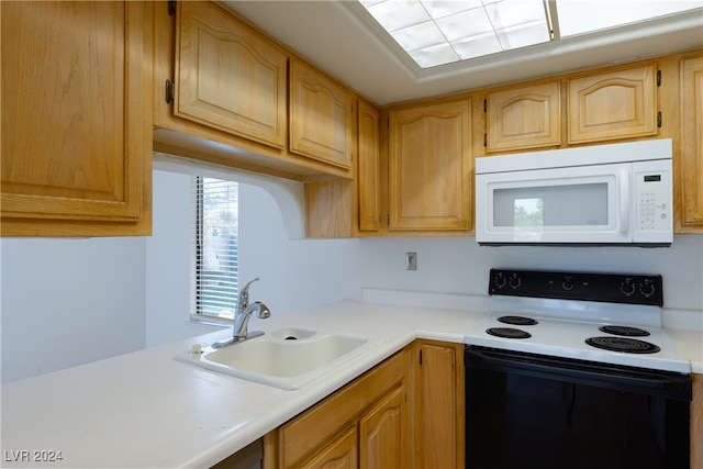 kitchen with white appliances and sink