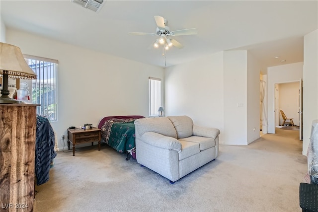 carpeted bedroom featuring ceiling fan