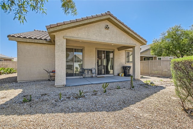 rear view of house with a patio