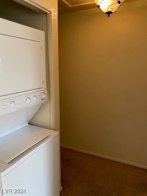 washroom featuring dark carpet and stacked washer / dryer