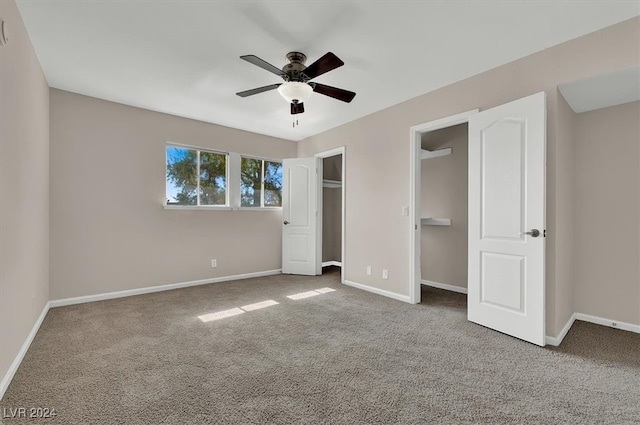 unfurnished bedroom with carpet and ceiling fan