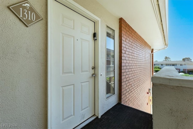 doorway to property with a balcony