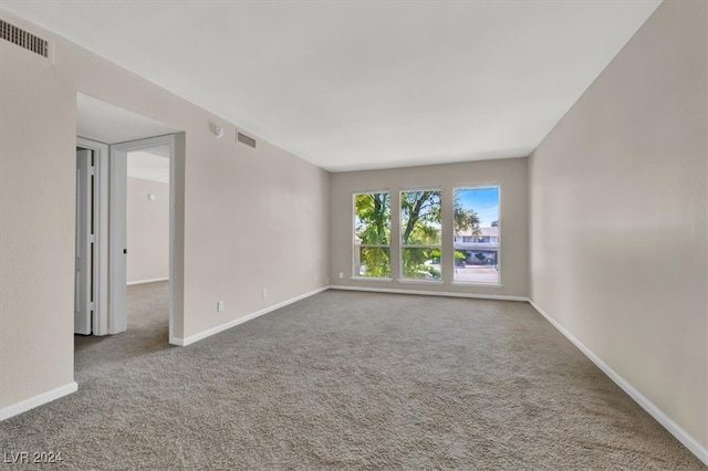 spare room featuring carpet floors