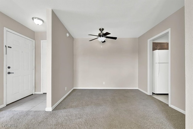 foyer with light colored carpet and ceiling fan