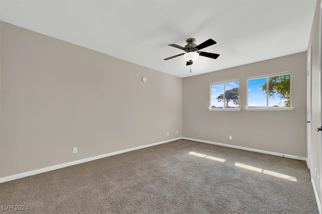 carpeted empty room with ceiling fan