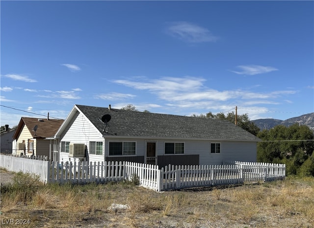 back of house featuring a mountain view