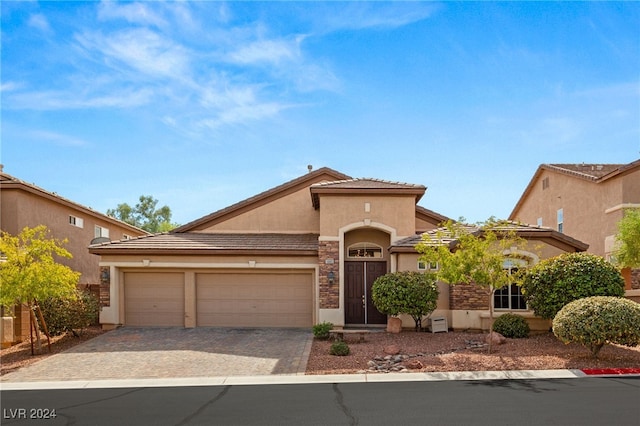 view of front of home with a garage