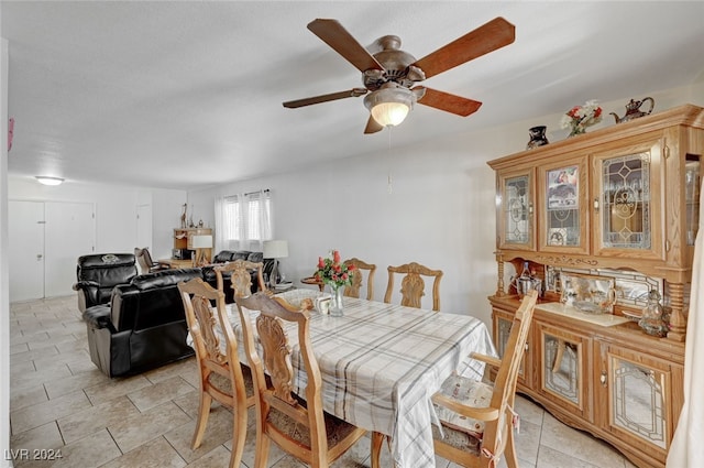 dining room featuring ceiling fan