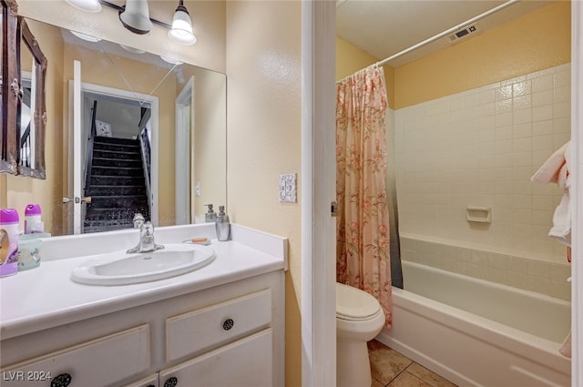 full bathroom featuring shower / bath combo, tile patterned floors, toilet, and vanity