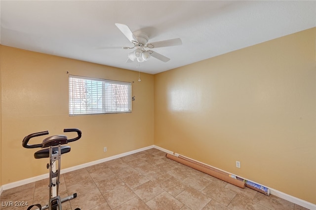 exercise room with ceiling fan