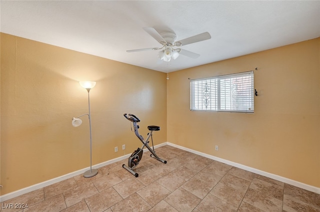 exercise room with ceiling fan