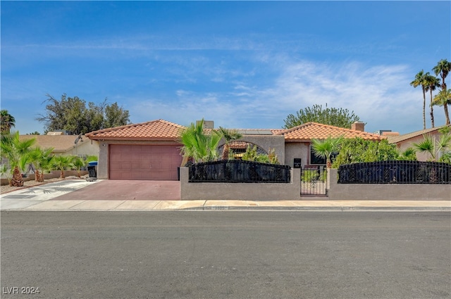 mediterranean / spanish home featuring a garage