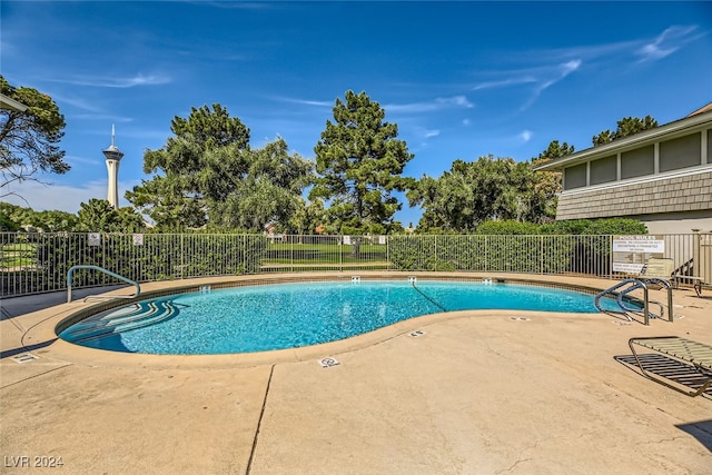 view of swimming pool with a patio area