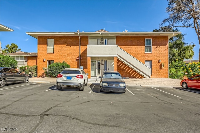 view of front of property with a balcony