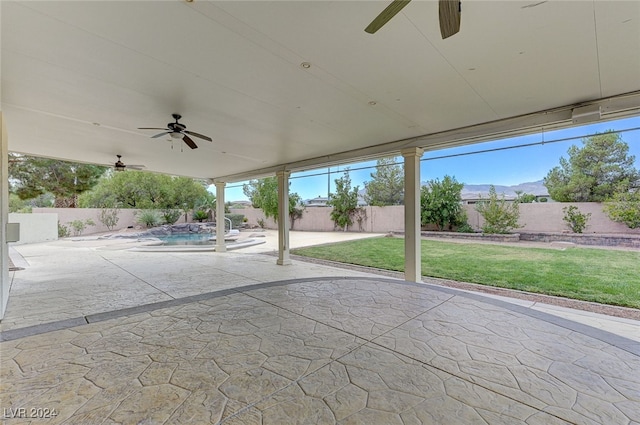 view of patio / terrace featuring a mountain view and ceiling fan