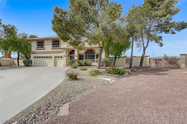 mediterranean / spanish house with a garage