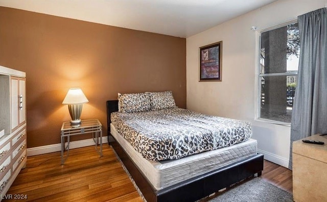 bedroom featuring dark wood-type flooring