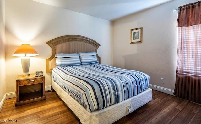 bedroom featuring dark hardwood / wood-style floors