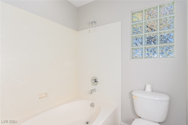 bathroom featuring toilet and shower / washtub combination