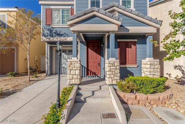 property entrance with a garage