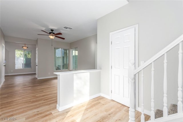 interior space featuring light hardwood / wood-style floors and ceiling fan