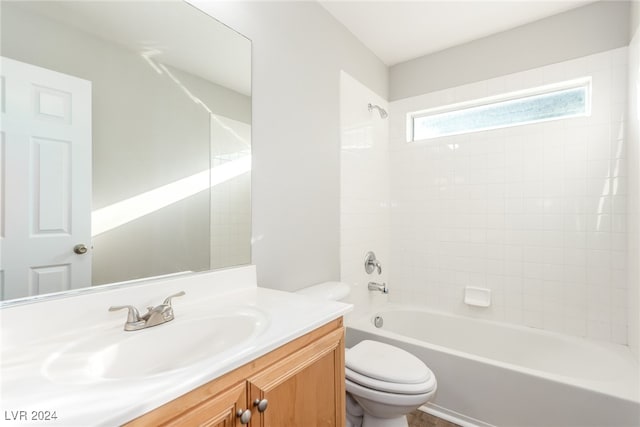 full bathroom with vanity, toilet, and tiled shower / bath