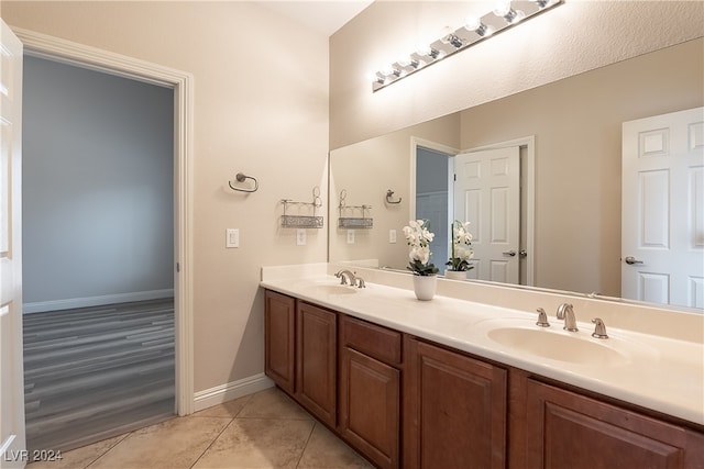 bathroom with vanity and hardwood / wood-style floors