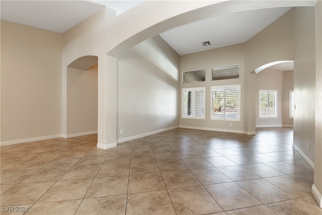 unfurnished room featuring light tile patterned floors