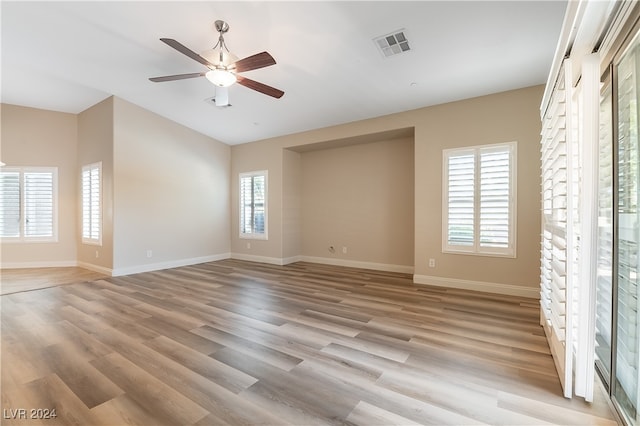 unfurnished bedroom with ceiling fan and light hardwood / wood-style flooring