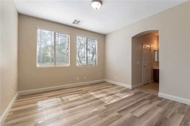 unfurnished room featuring light hardwood / wood-style floors