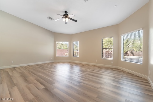 unfurnished room featuring light hardwood / wood-style flooring and ceiling fan