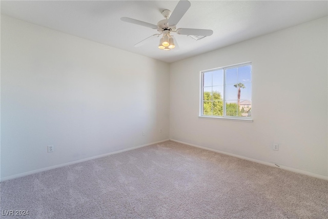 carpeted empty room with ceiling fan