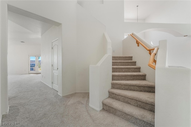 stairs featuring carpet