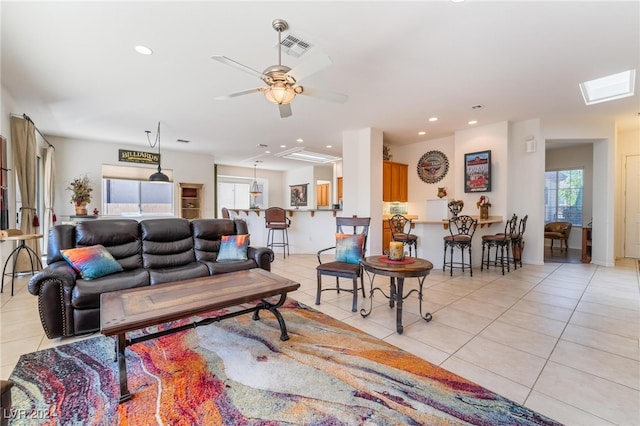 tiled living room featuring ceiling fan