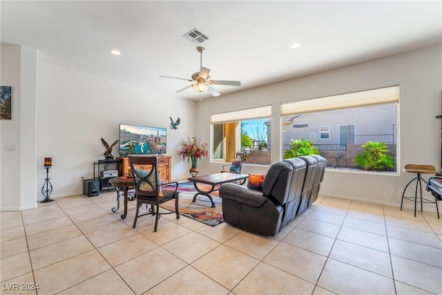 tiled living room with ceiling fan