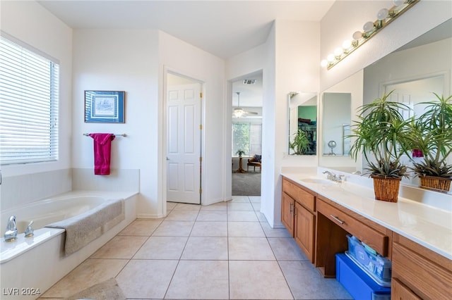 bathroom with vanity, a bathtub, and tile patterned flooring