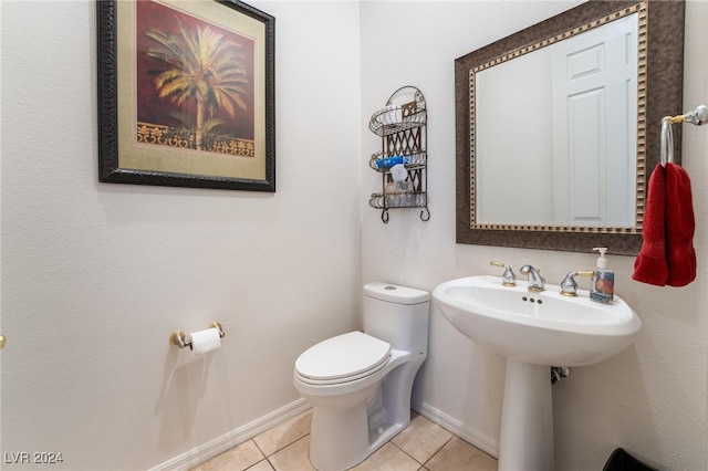 bathroom with tile patterned floors and toilet